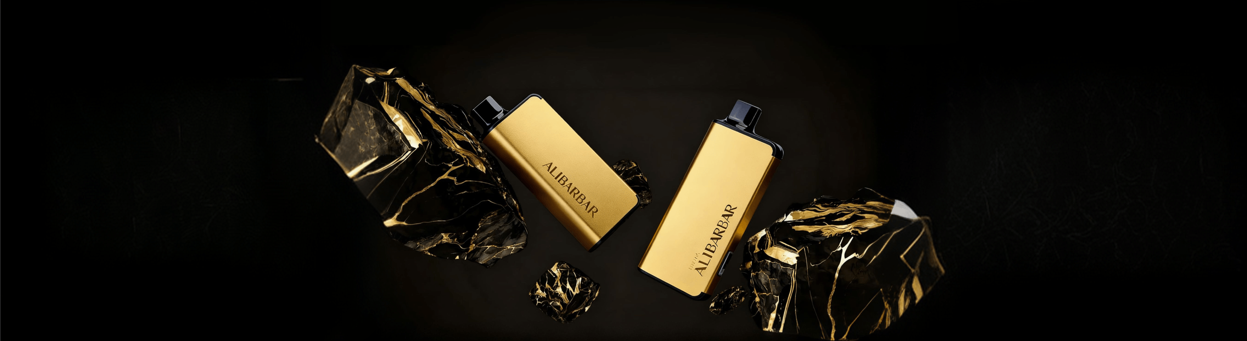 Two metallic gold Alibarbar disposable vape devices on a black marble background